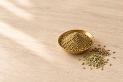 Digestive Wellness Blend powder close up in a shallow brass dish