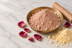 Radiance Face Mask powder close up in a shallow brass dish